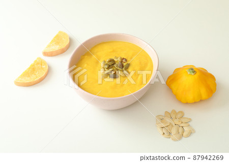 Flat lay with pumpkin soup ingredients on white background Flat lay with pumpkin soup ingredients on white background 87942269