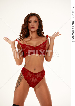 Photo of sexy woman posing in red lingerie over the white background 87942513