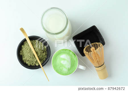 Matcha latte and accessories for making on white background 87942672