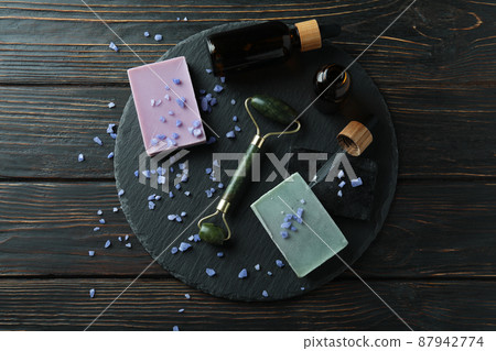 Skin care concept with face roller on rustic wooden table 87942774