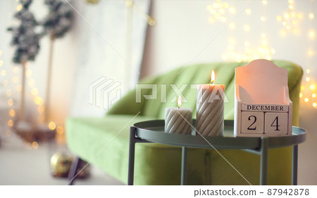 Christmas eve date. December 24 on wooden calendar standing on small tea table at home 87942878