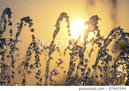 drops of the fountain in the setting sun drops of the fountain in the setting sun 87942984