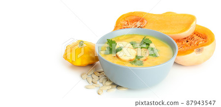 Pumpkin soup and ingredients isolated on white background 87943547