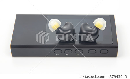 In-ear headphones for Hi-Fi music player. Audio sound and modern equipment In-ear headphones for Hi-Fi music player. Audio sound and modern equipment 87943943