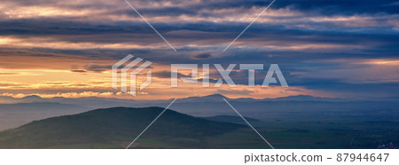 Sunset dramatic sky over mountains shape 87944647