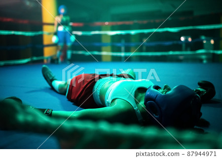 Close-up of boxer girl in knockout on ring 87944971