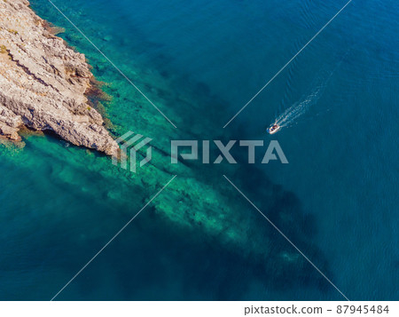 Picturesque sea Adriatic coast of Montenegro. Turquoise Mediteran sea and rocky shore with evergreen coniferous trees. Wonderful summer landscape. Drone 87945484