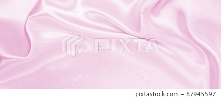 Smooth elegant pink silk or satin texture as wedding background. Luxurious background design Smooth elegant pink silk or satin texture as wedding background. Luxurious background design 87945597
