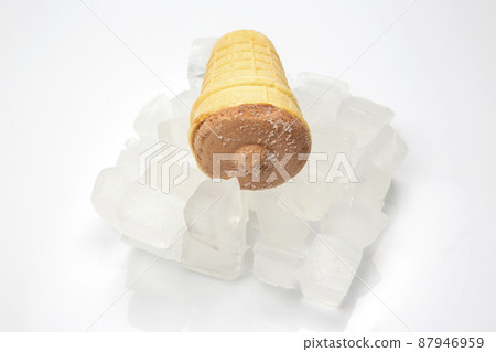 chocolate ice cream in a waffle cone glass in pieces of ice. dessert food chocolate ice cream in a waffle cone glass in pieces of ice. dessert food 87946959