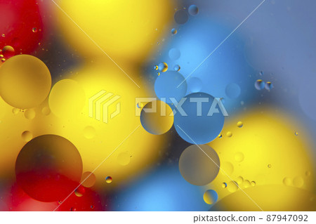 abstract colored balls of oily liquid on a blurred background 87947092