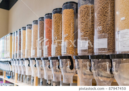 Pastas in sustainable plastic free grocery store. Dispensers of pastas in zero waste grocery store Pastas in sustainable plastic free grocery store. Dispensers of pastas in zero waste grocery store 87947450