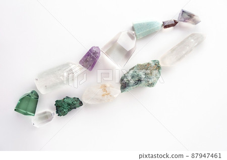 Set of healing minerals and crystal stones on white background. Flat lay of various gemstones and crystals Set of healing minerals and crystal stones on white background. Flat lay of various gemstones and crystals 87947461