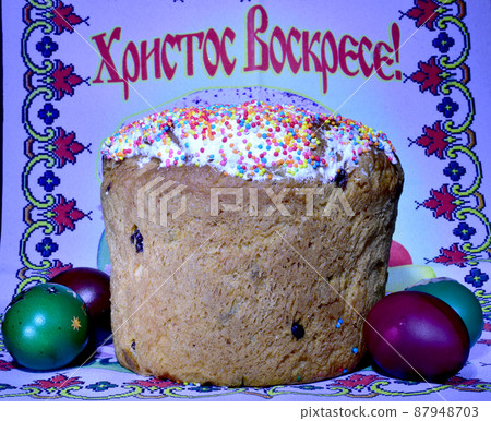 Festive cake and colored eggs. Festive cake and colored eggs. 87948703