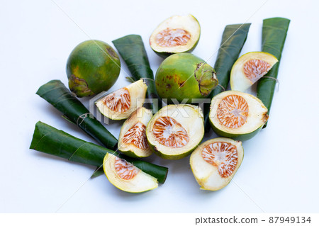 Chewing betel nut, Betel nut with cal lime powder on betel leaves 87949134