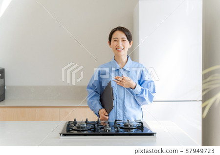 Female remodeling inspection of work clothes 87949723