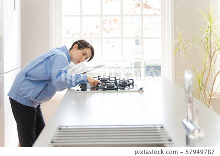 Female remodeling inspection of work clothes Female remodeling inspection of work clothes 87949787