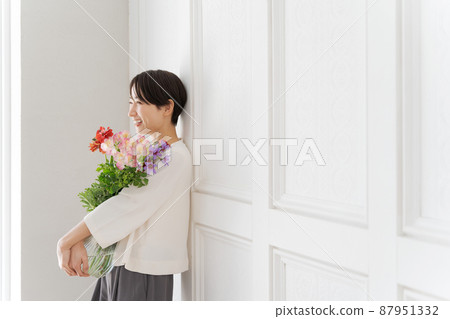 A woman holding a bouquet A woman holding a bouquet 87951332