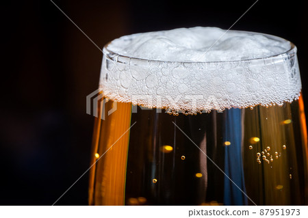 Beer that shines on a black background Beer that shines on a black background 87951973