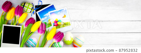 Easter background with colorful easter eggs on wooden background. Easter background with colorful easter eggs on wooden background. 87952832