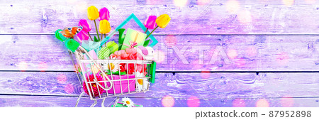 Mini shopping cart with colorful flowers and butterflies. Mini shopping cart with colorful flowers and butterflies. 87952898
