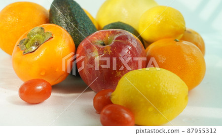 Various fruits such as lemon, persimmon, apple Various fruits such as lemon, persimmon, apple 87955312