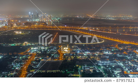 Garden in Zabeel district with skyscrapers on a background aerial night timelapse in Dubai, UAE Garden in Zabeel district with skyscrapers on a background aerial night timelapse in Dubai, UAE 87957821