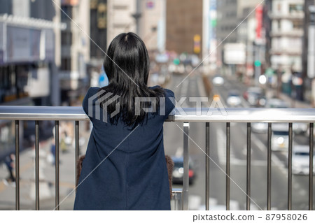 A woman looking at the scenery from the pedestrian bridge Pedestrian bridge 87958026