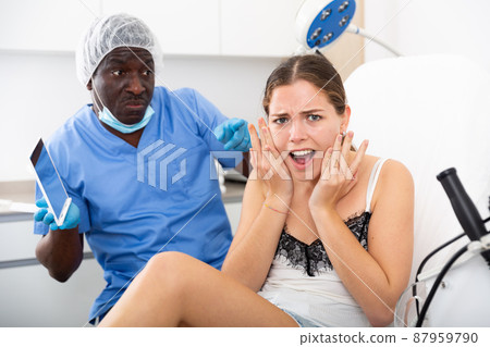 Female patient unpleasantly surprised by results of cosmetic procedures Female patient unpleasantly surprised by results of cosmetic procedures 87959790