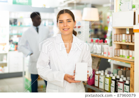Pharmacist with drug package Pharmacist with drug package 87960079