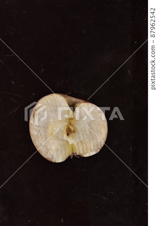 Half apple on dark background 87962542
