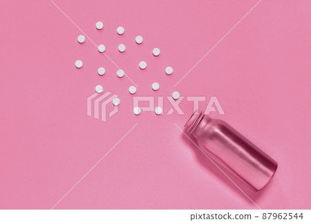 Pink medicine bottle and pills Pink medicine bottle and pills 87962544