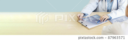 Banner Two asian women doctors discuss meeting office medical clinic. Young asian female doctor looking x-ray film consulting patient disease together. Panorama Asian medical care lab with copy space 87963571