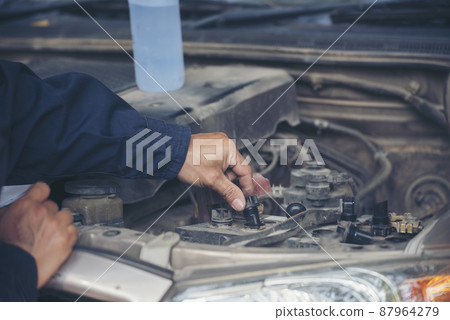Mechanic car service auto garage in automotive mobile center. Technician workshop repair engine motor vehicles service mechanical engineering business. Automobile mechanic hands car repairs technic 87964279