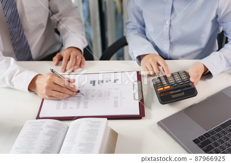 Business concept, Two business colleague brainstorm about investment and calculate cost of project 87966925