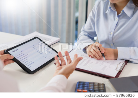 Business concept, Business colleague explain financial data to partner while talking about project 87966926