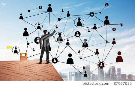 Businessman on house roof presenting networking and connection concept. Mixed media 87967053