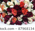Close-up lying bouquet of multi-colored fresh roses 87968134