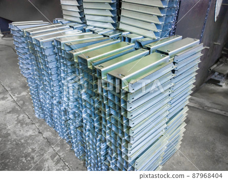 stacks of profile bent sheet metal parts on factory floor stacks of profile bent sheet metal parts on factory floor 87968404