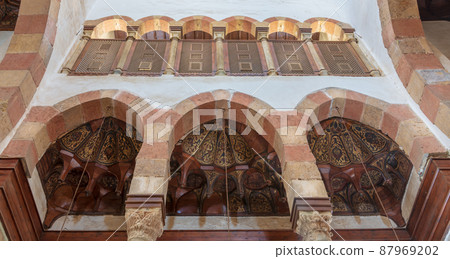 Three arches revealing three wooden domes decorated with floral patterns with interleaved wood window (Mashrabiya), Beshtak palace Three arches revealing three wooden domes decorated with floral patterns with interleaved wood window (Mashrabiya), Beshtak palace 87969202