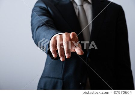 Pointing businessman 87970664