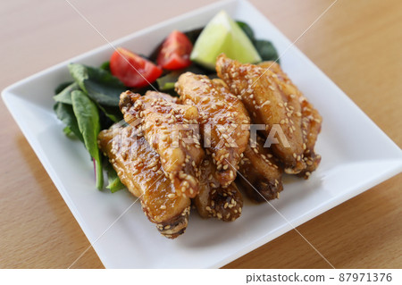 Fried chicken wings with sweet and spicy chicken wings Fried chicken wings with sweet and spicy chicken wings 87971376