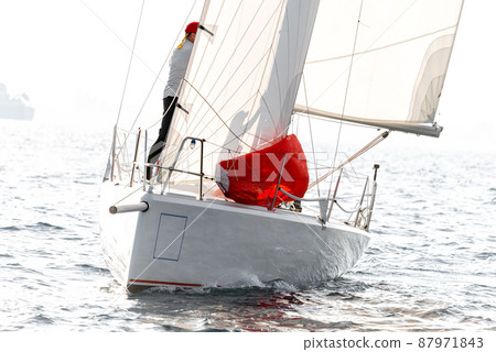 Racing keelboat during regatta competition 87971843