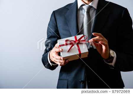 A businessman with a gift A businessman with a gift 87972069