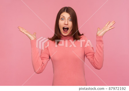 Oh my god, I cant believe this. Amazed shocked woman wondered with great news, screaming looking at camera with big eyes. Indoor studio shot isolated on pink background Oh my god, I cant believe this. Amazed shocked woman wondered with great news, screaming looking at camera with big eyes. Indoor studio shot isolated on pink background 87972192