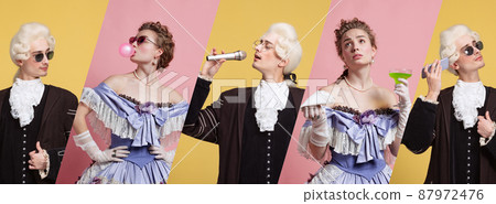 Medieval people as a royalty persons in vintage clothing posing proud and confident on pink yellow background. Concept of comparison of eras Medieval people as a royalty persons in vintage clothing posing proud and confident on pink yellow background. Concept of comparison of eras 87972476