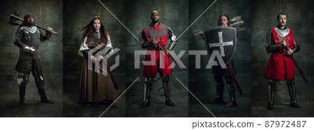 Heroes. Creative art collage with brutal serious medieval warriors or knights in war clothes with wounded faces holding shield, sword isolated over dark vintage background. Heroes. Creative art collage with brutal serious medieval warriors or knights in war clothes with wounded faces holding shield, sword isolated over dark vintage background. 87972487