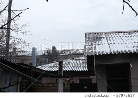MARIUPOL, UKRAINE - March. 5, 2022: War of Russia against Ukraine. Residential Building roof damaged by enemy artillery MARIUPOL, UKRAINE - March. 5, 2022: War of Russia against Ukraine. Residential Building roof damaged by enemy artillery 87972637
