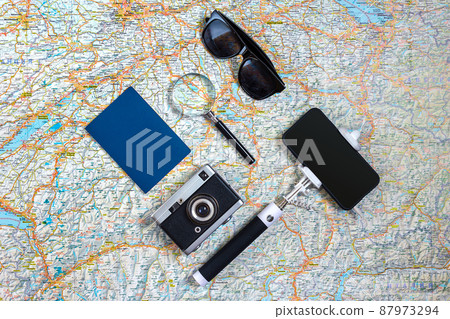 Travel accessories set on white background: smart, passport, map, camera and sunglasses. Top view point. 87973294