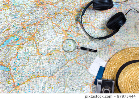 Travel plan, trip vacation accessories for trip, tourism mockup - Outfit of traveler on map background. Flat lay and copyspace. 87973444