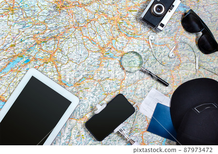 Travel plan, trip vacation accessories for trip, tourism mockup - Outfit of traveler on map background. Flat lay and copyspace. Travel plan, trip vacation accessories for trip, tourism mockup - Outfit of traveler on map background. Flat lay and copyspace. 87973472